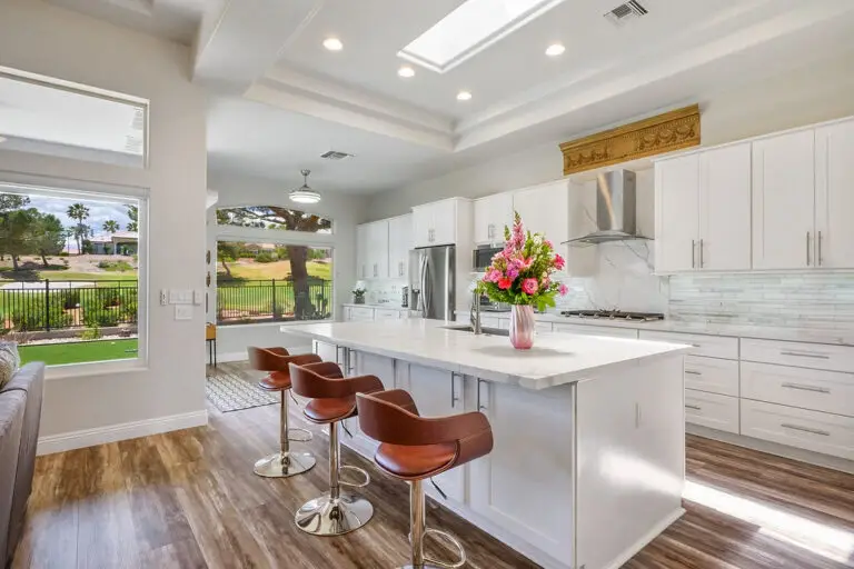 Aristocrat Floor Plan in Sun City Summerlin kitchen with island and view to patio