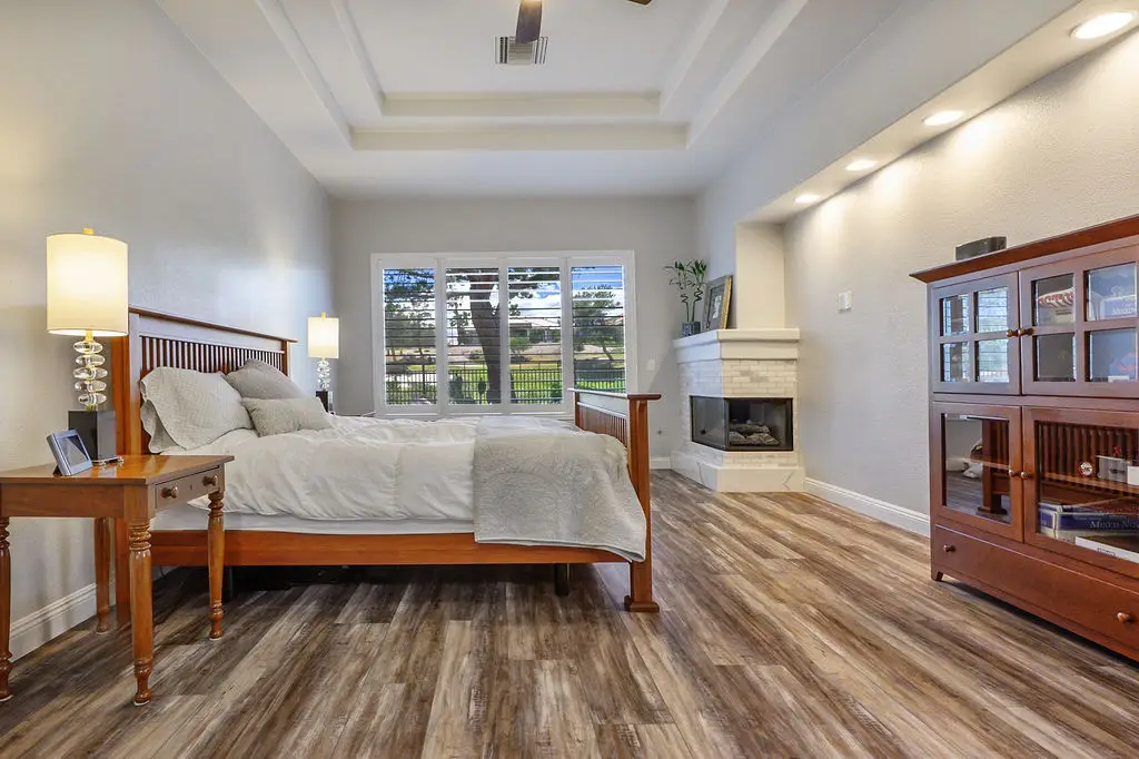 Aristocrat Floor Plan in Sun City Summerlin primary bedroom with coffered ceilings and en-suite bath