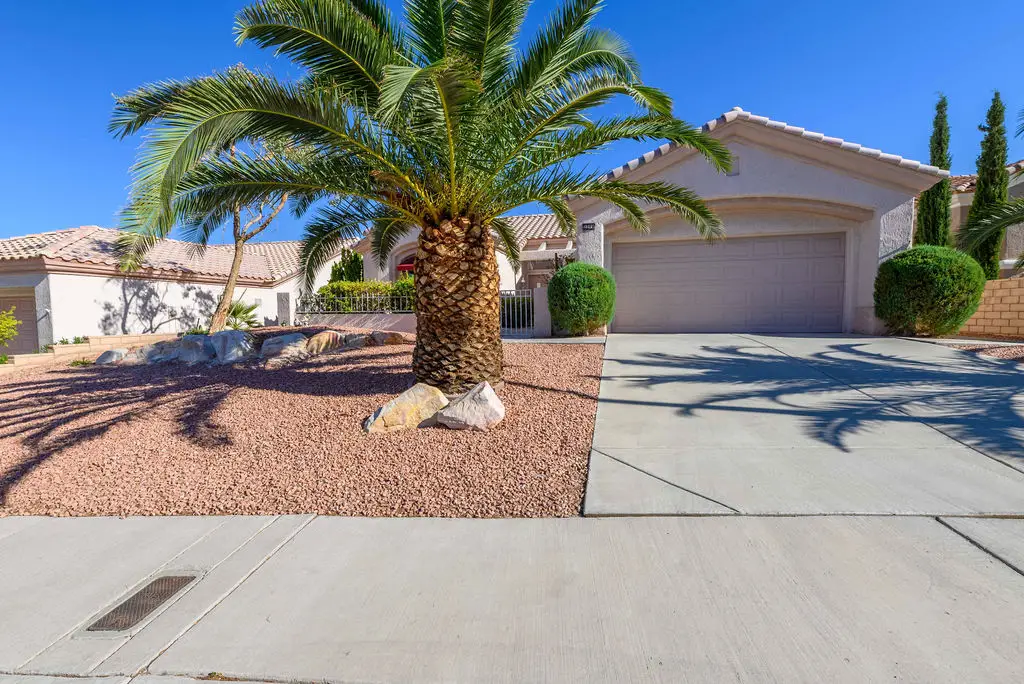 Tahoe Floor Plan in Sun City Summerlin front exterior with tile roof, desert landscaping, and arched entryway.